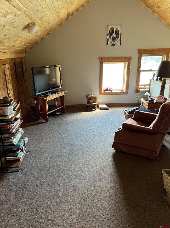 Loft upstairs with living space, storage, 2 bedrooms and 1 full bath