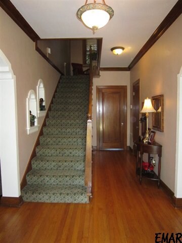 Beuatiful hardwood floors and staircase to second 