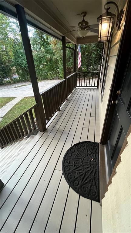 Wooden porch with ceiling fan