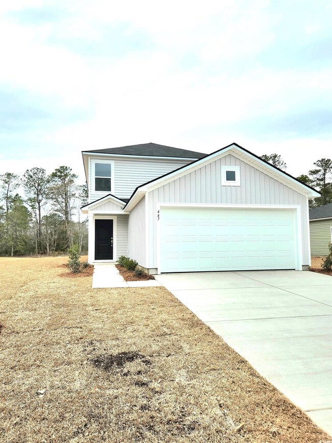 View of front facade with a garage