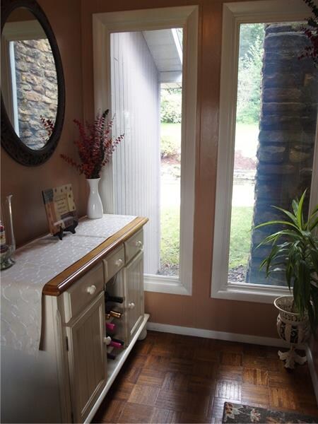 The entry has beautiful windows to the rear yard, 