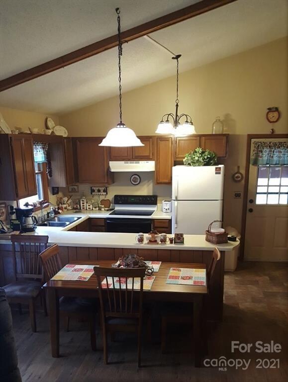 Efficient kitchen with elevated ceiling. 