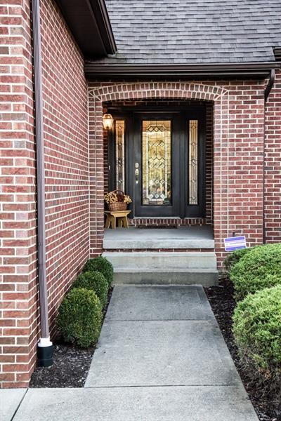 The charming front entrance with leaded glass door