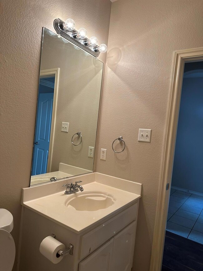 Bathroom featuring tile patterned floors, vanity, 