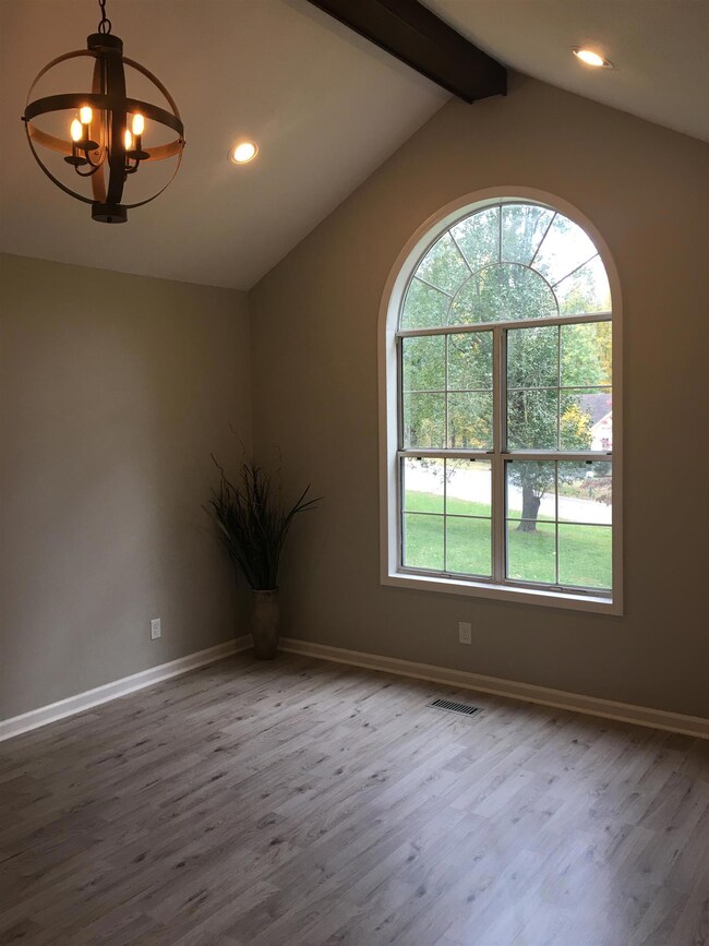 Living Room with Vaulted Ceiling with New Lighting. 