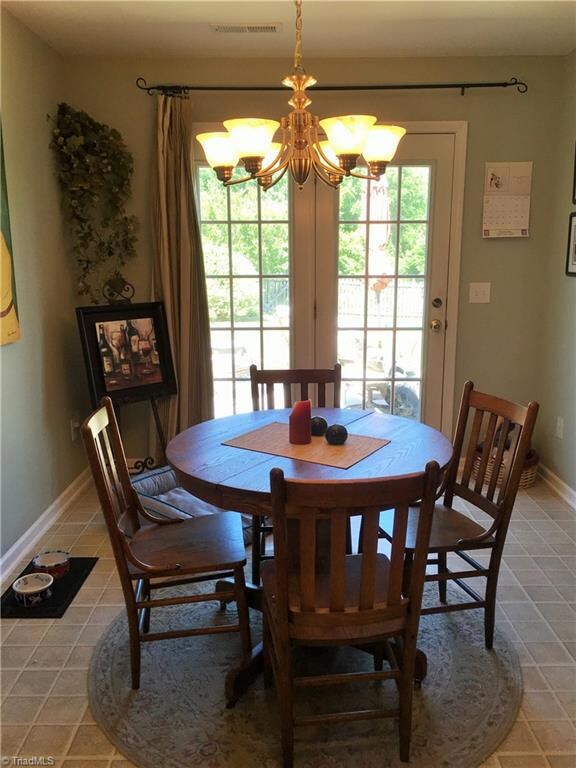 Dining room has lots of space and french doors to patio for grilling and fun!