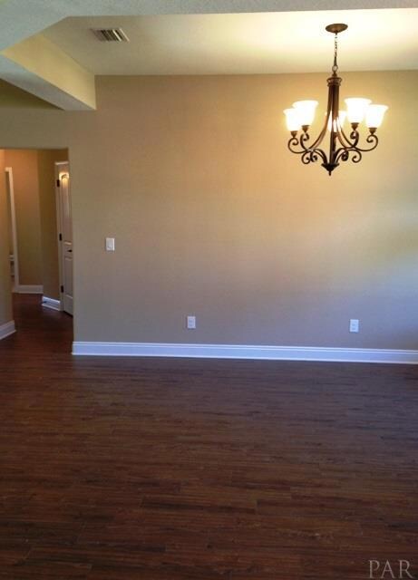 A beautiful formal dining room is seen here.