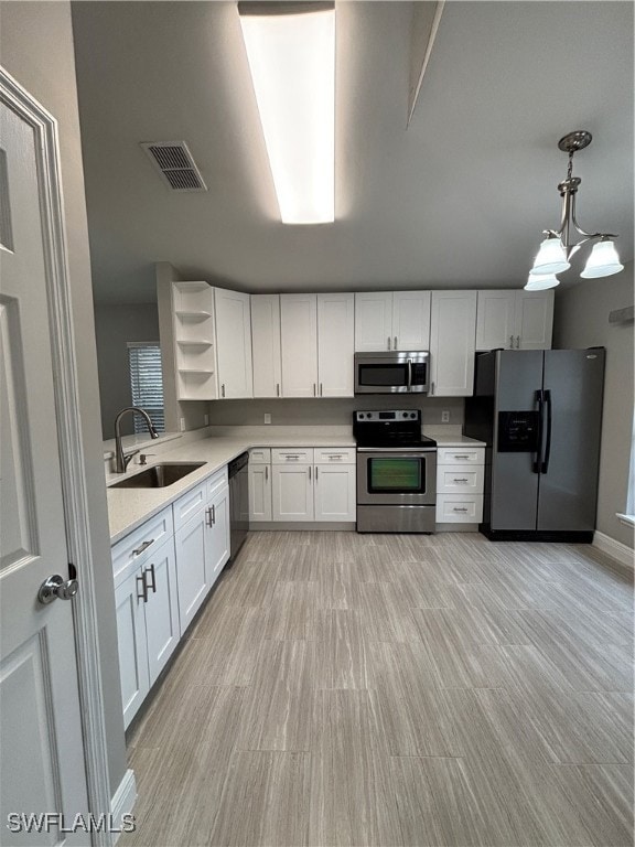 Kitchen featuring stove, refrigerator, dishwashing