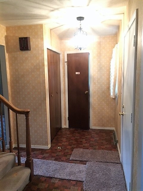 Foyer, coat closet, half bath