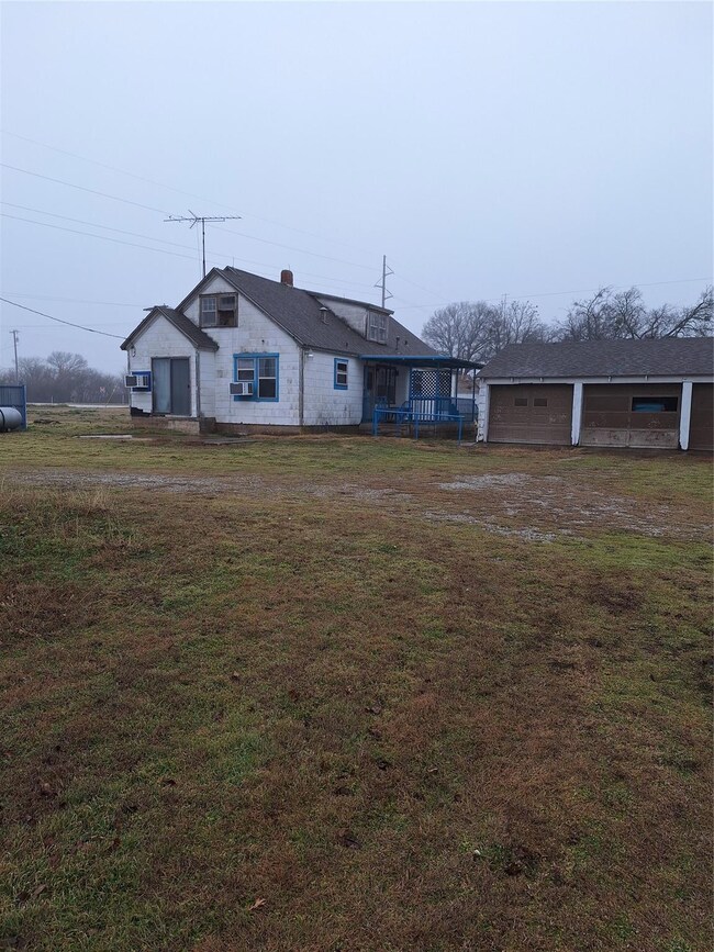 View of front facade featuring a garage