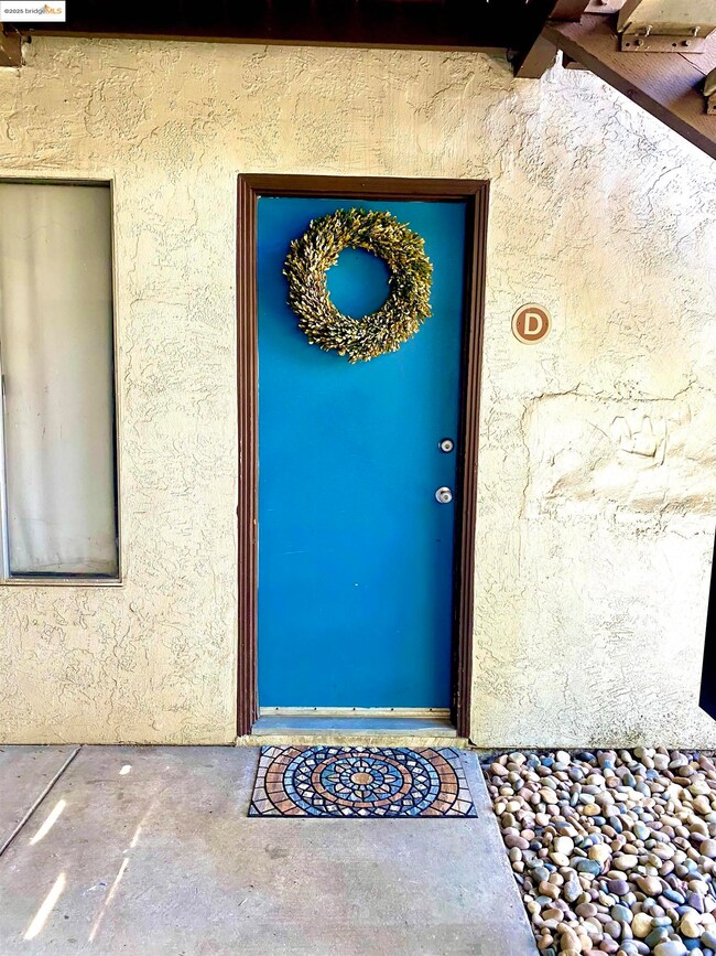 View of exterior entry featuring stucco siding