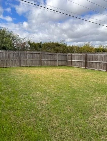 View of fenced backyard