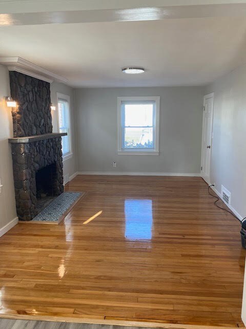 1ST Floor Formal Living Room w/ Stone Fireplace