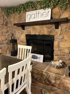 wood burning fireplace in dining room