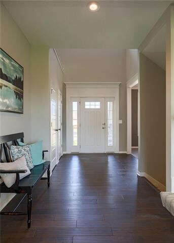 The two-story entryway has two coat closets.