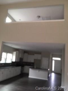 Looking into kitchen from family room with opening