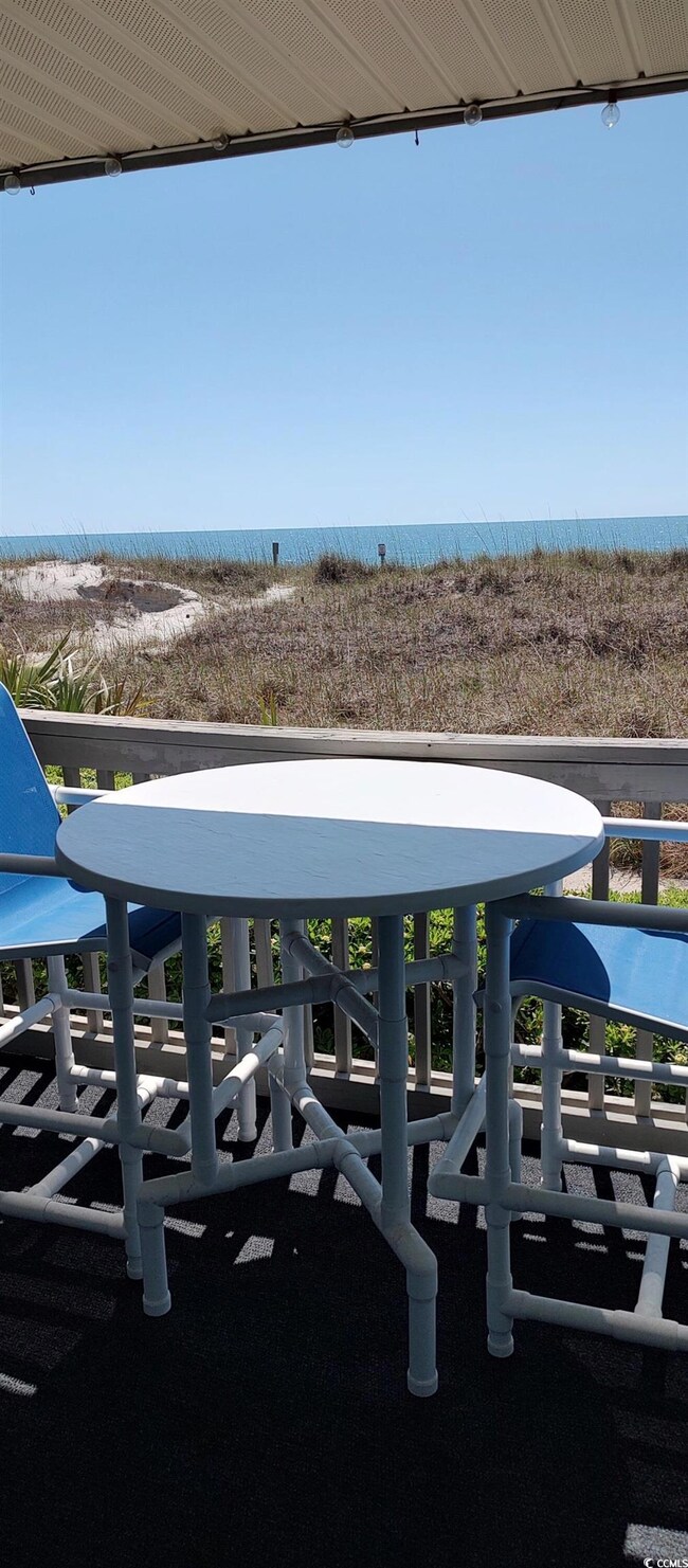 Exterior space featuring view of water and beach a