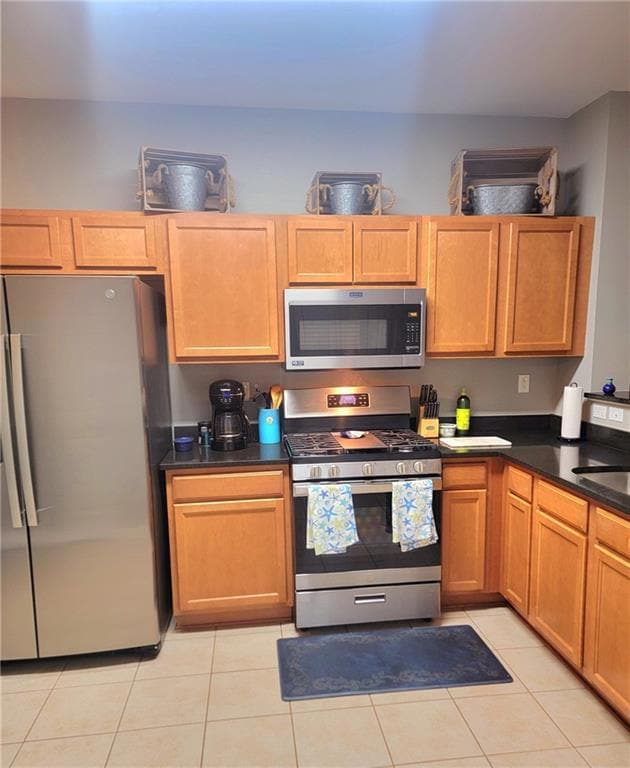 Such pretty cabinets and stainless appliances