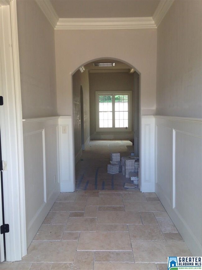 As you enter the home, you are greeted by Versaill