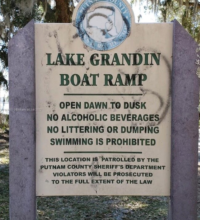 Image of Grandin Lake Posted Sign. Please contact 