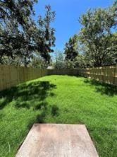View of yard featuring a fenced backyard