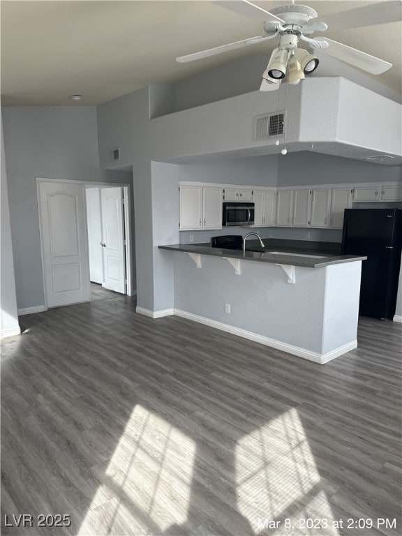Kitchen featuring stainless steel microwave, frees