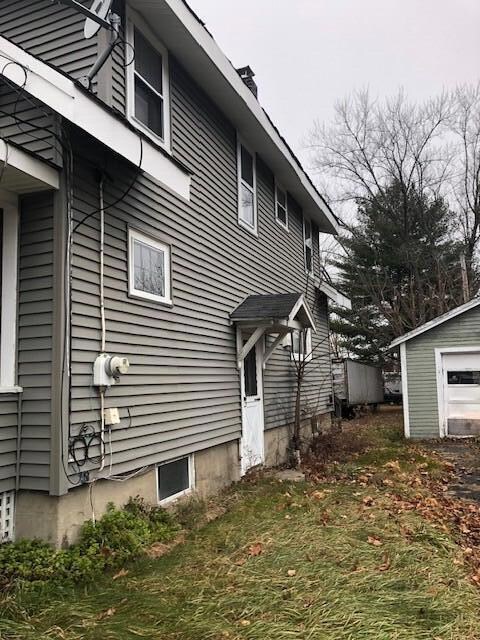 Exterior driveway side with basement doo