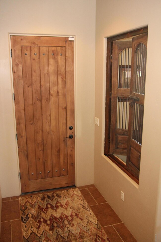 Front door with wood decor treatment