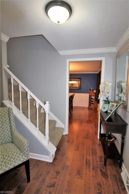 Welcoming Foyer is Flanked by the Formal Dining Ro