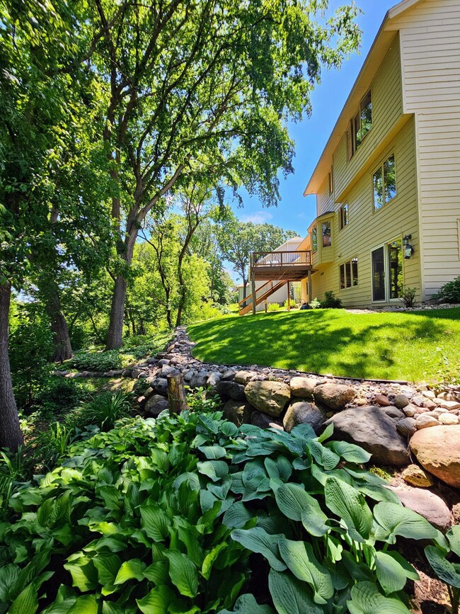 Picturesque lake Marion views, lush trees, and perennial gardens.