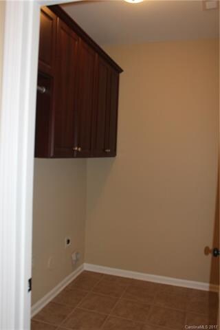 Laundry Room with Large Cabinets