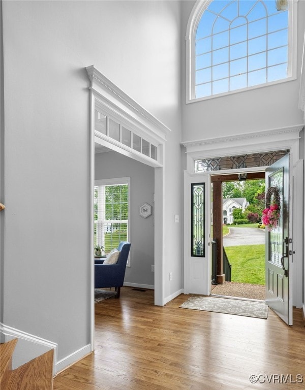 Foyer with hardwood floors and tons of natural lig