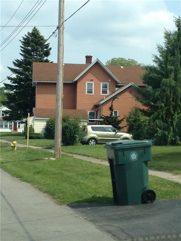 WEST VIEW OF HOME, GARAGE, ROOFS