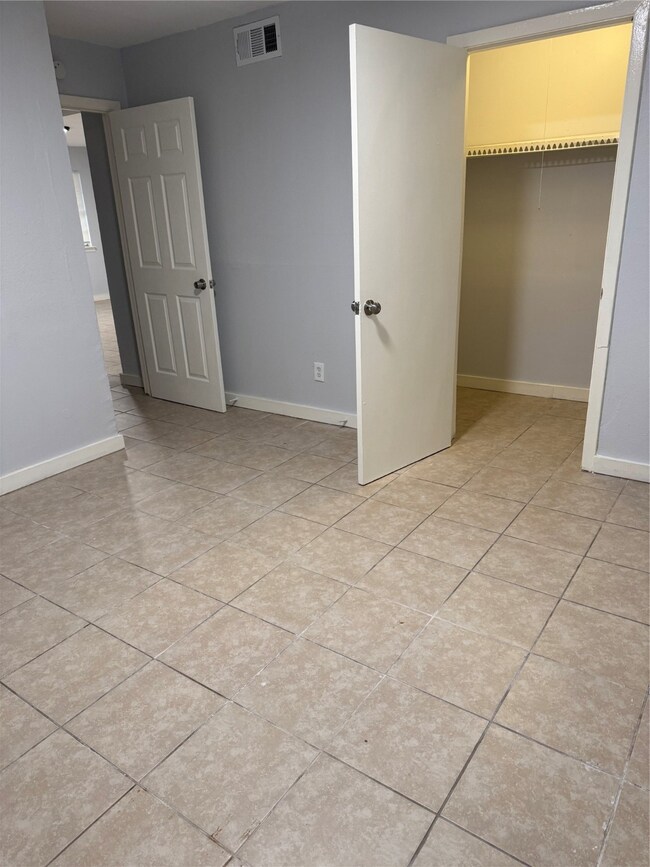 Spacious walk-in closet for ample storage and easy