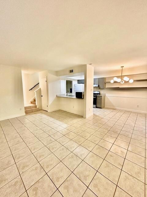 Unfurnished living room with light tile patterned