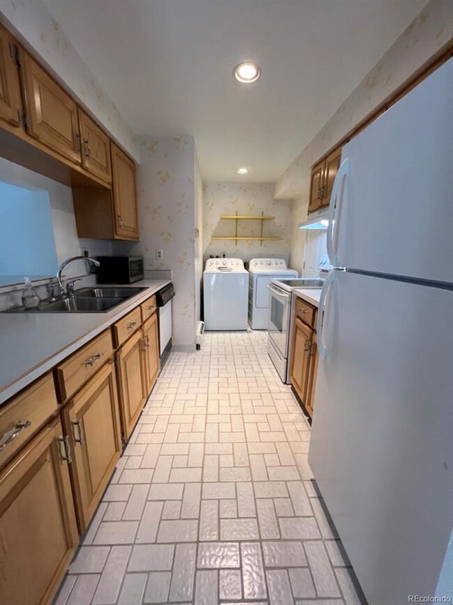 Nicely updated gally style kitchen with newer appl