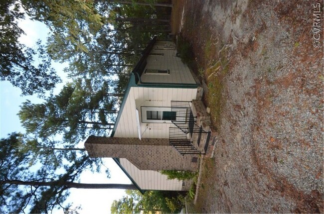 Side entry to the house from the two car wide driv