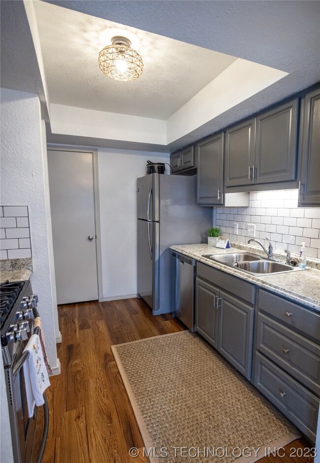 Kitchen with updated light fixture & beautiful cab