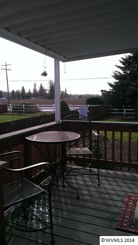Covered deck overlooking farm fields