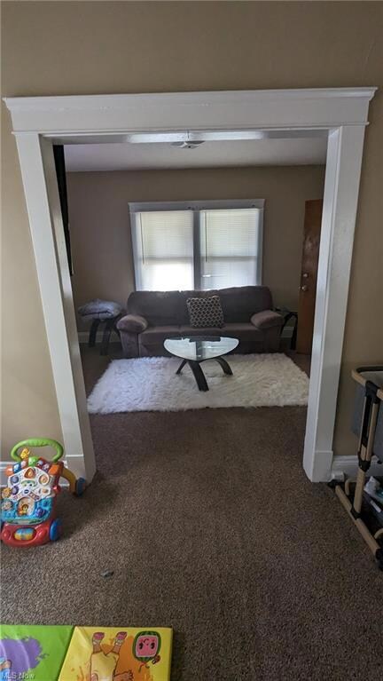 Corridor featuring carpet