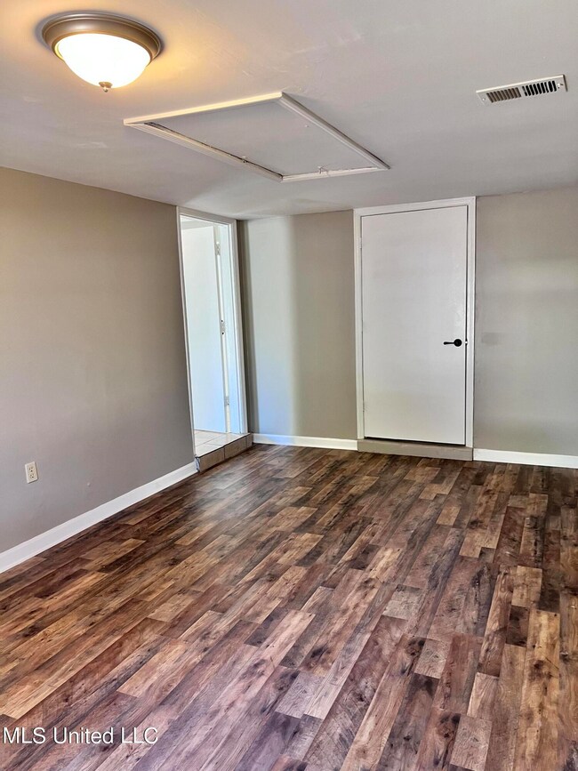 Large bedroom with laundry room