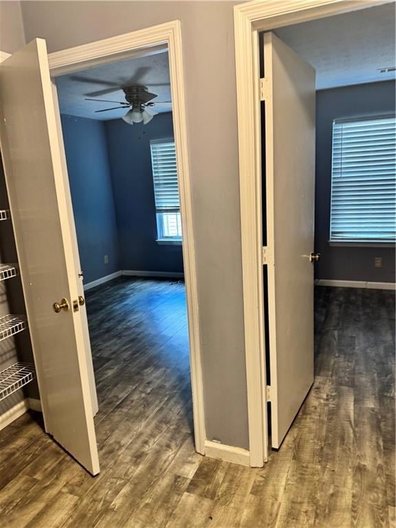 Hallway featuring wood finished floors