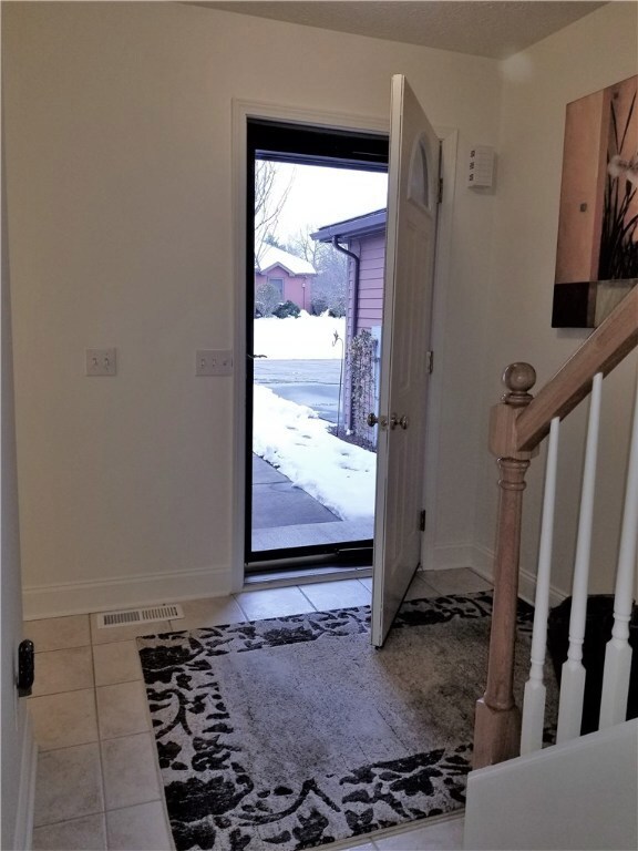 Main foyer, ceramic floors generous and welcoming.