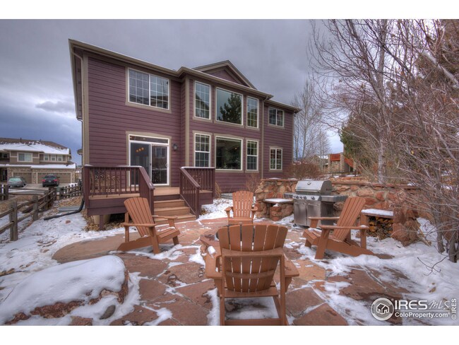 view of back patio, deck, and back of house