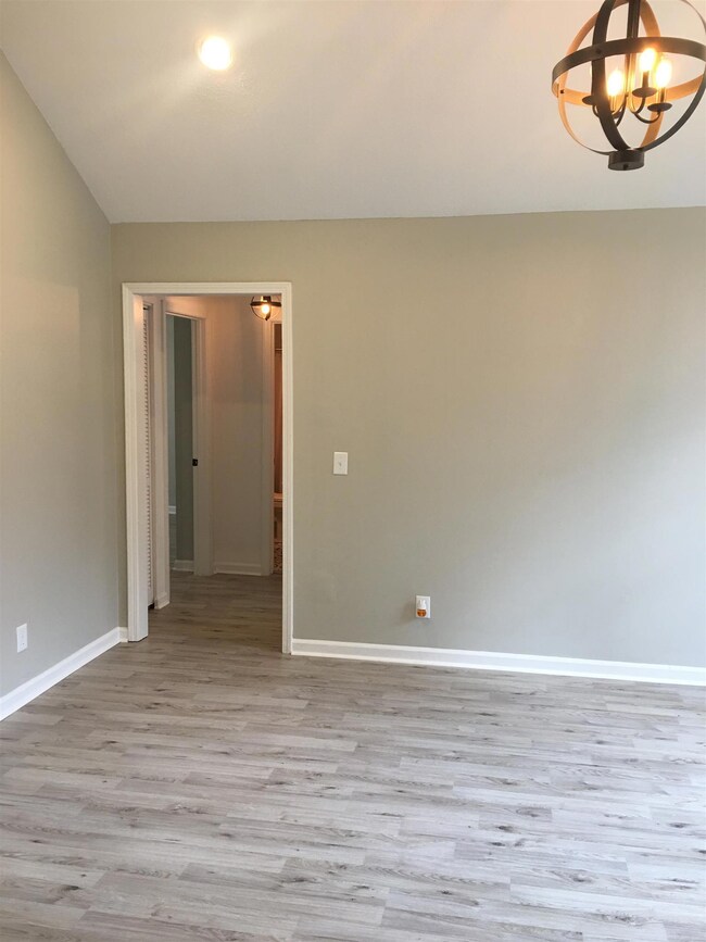 Living Room View  to the Hall Leading to the Bath and Other Bed Rooms. 