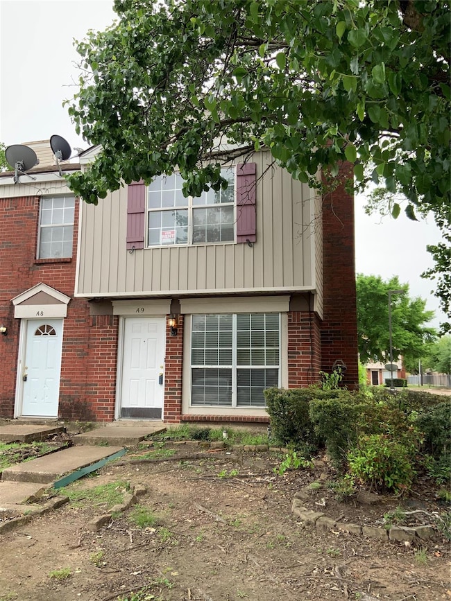 View of front of property featuring brick siding