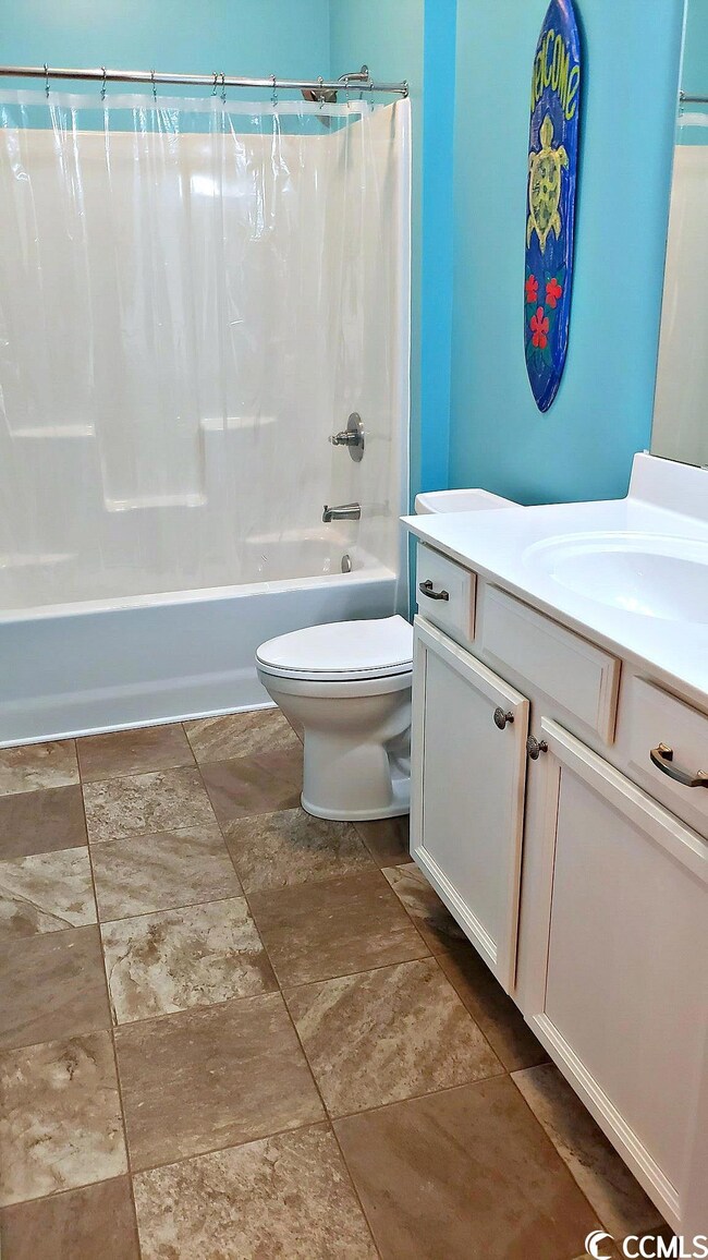 Tub/shower combo with tile floors.