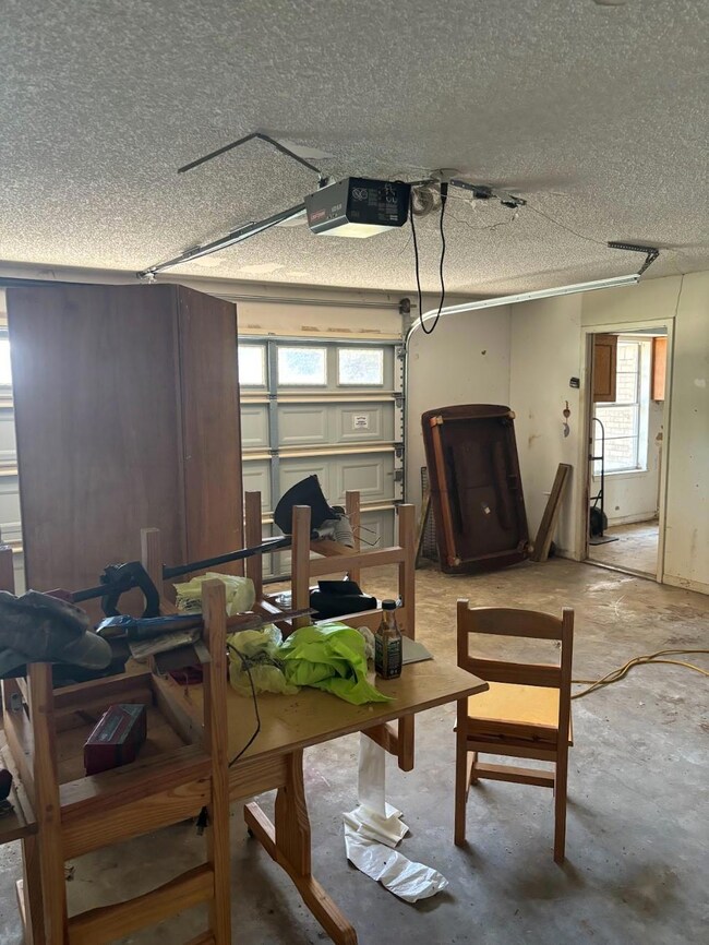 Garage featuring a garage door opener