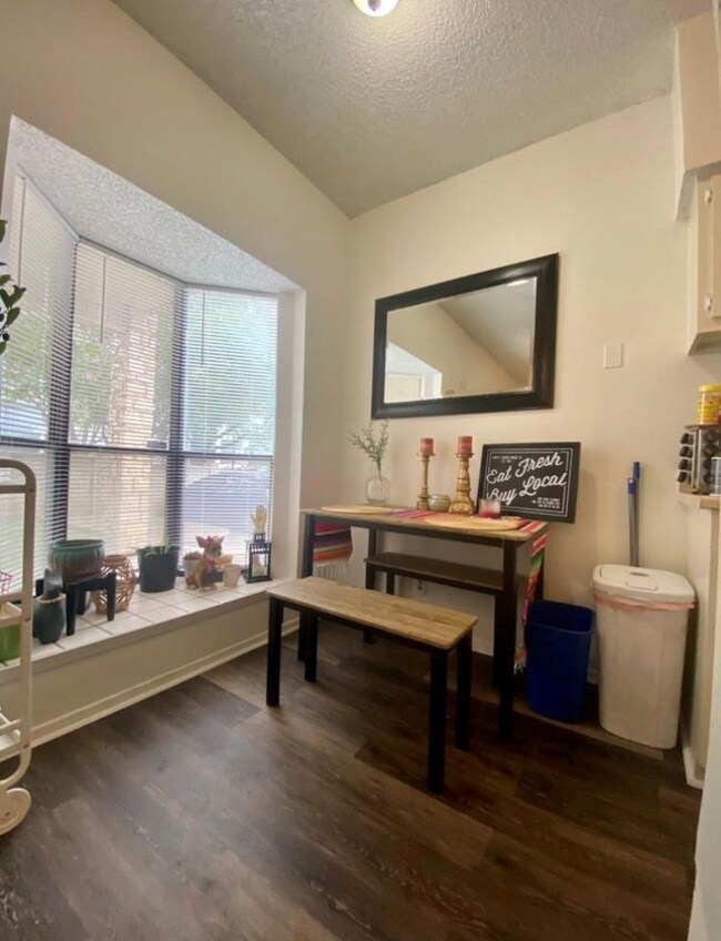 Home office featuring a textured ceiling and dark