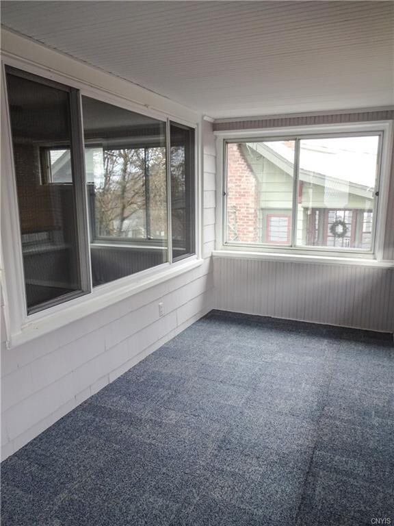 You'll love this enclosed porch at the front of th